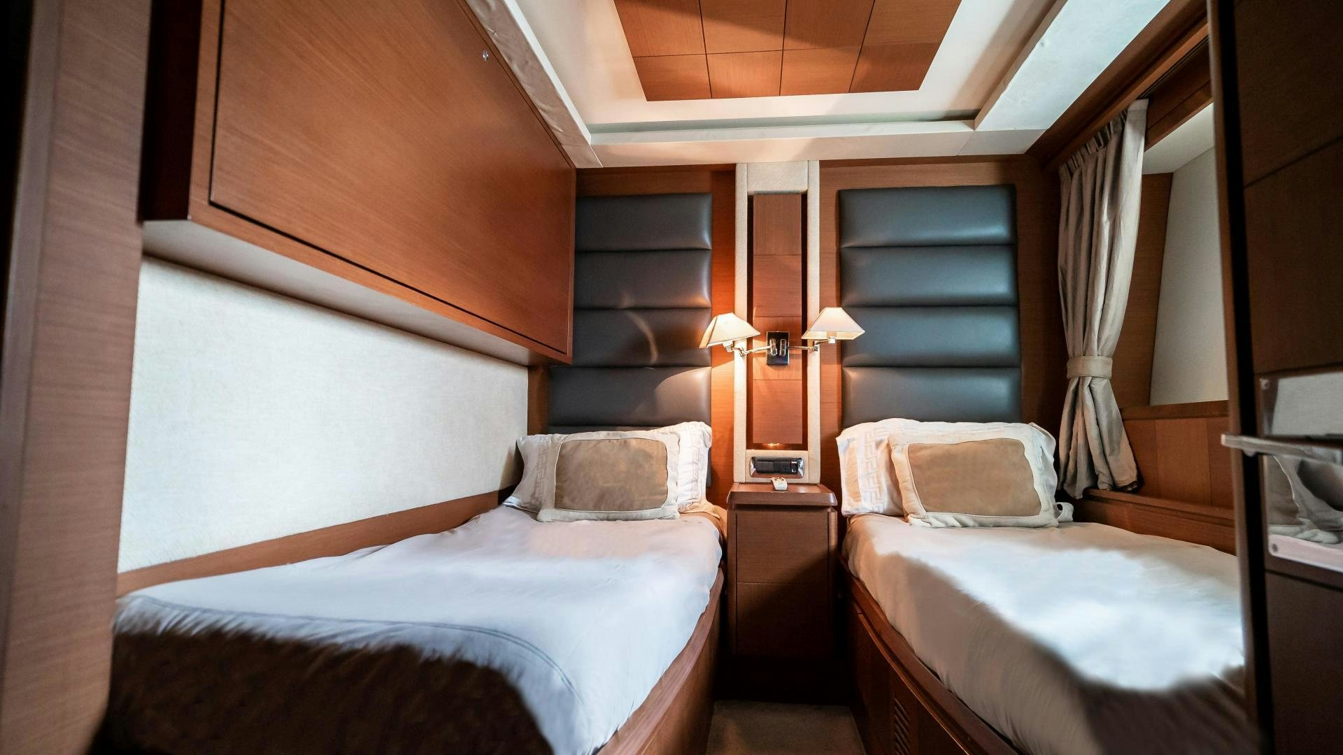 a couple of beds in a room aboard CAMY ED Yacht for Sale