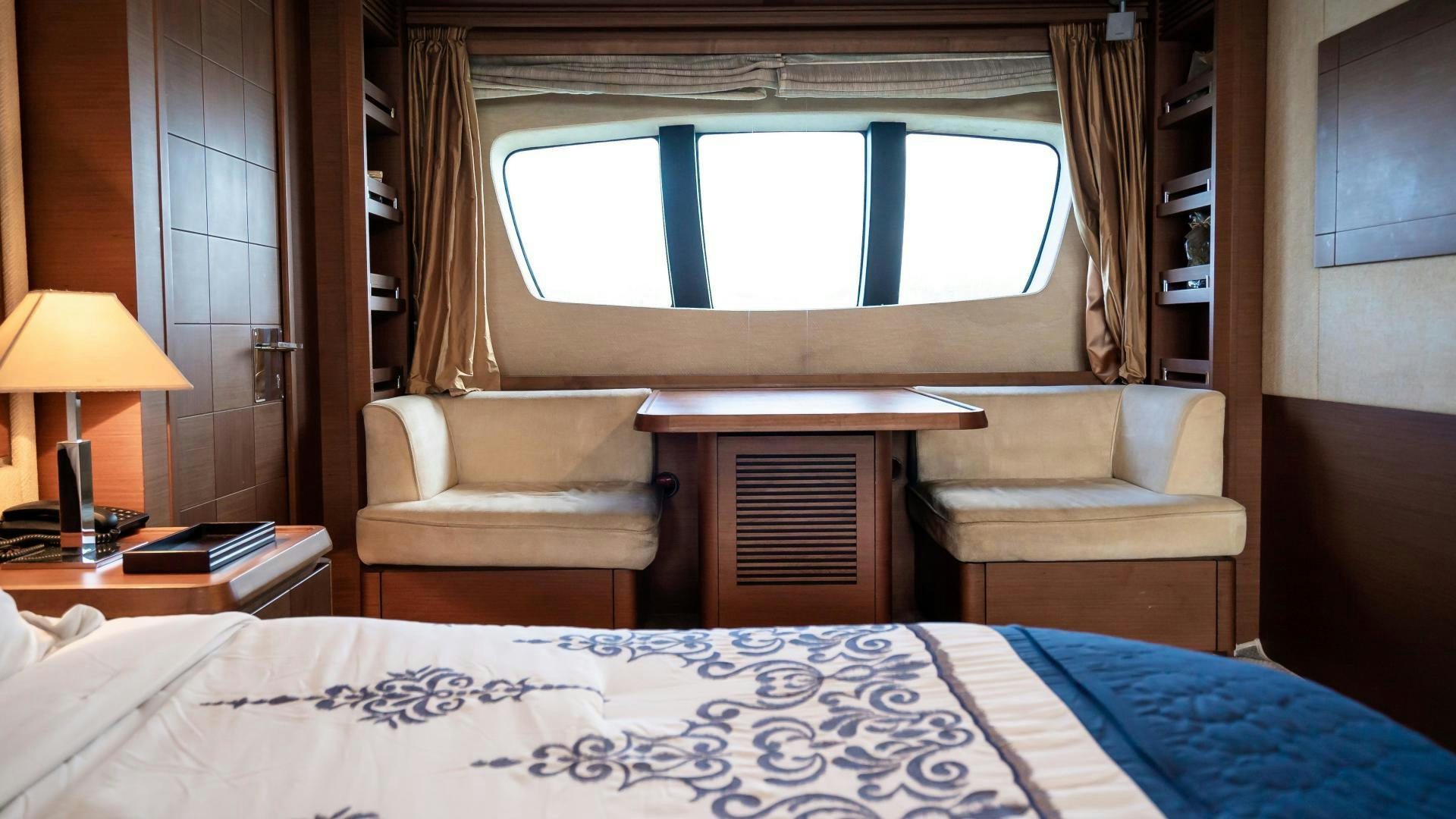 a room with a bed and a window aboard CAMY ED Yacht for Sale