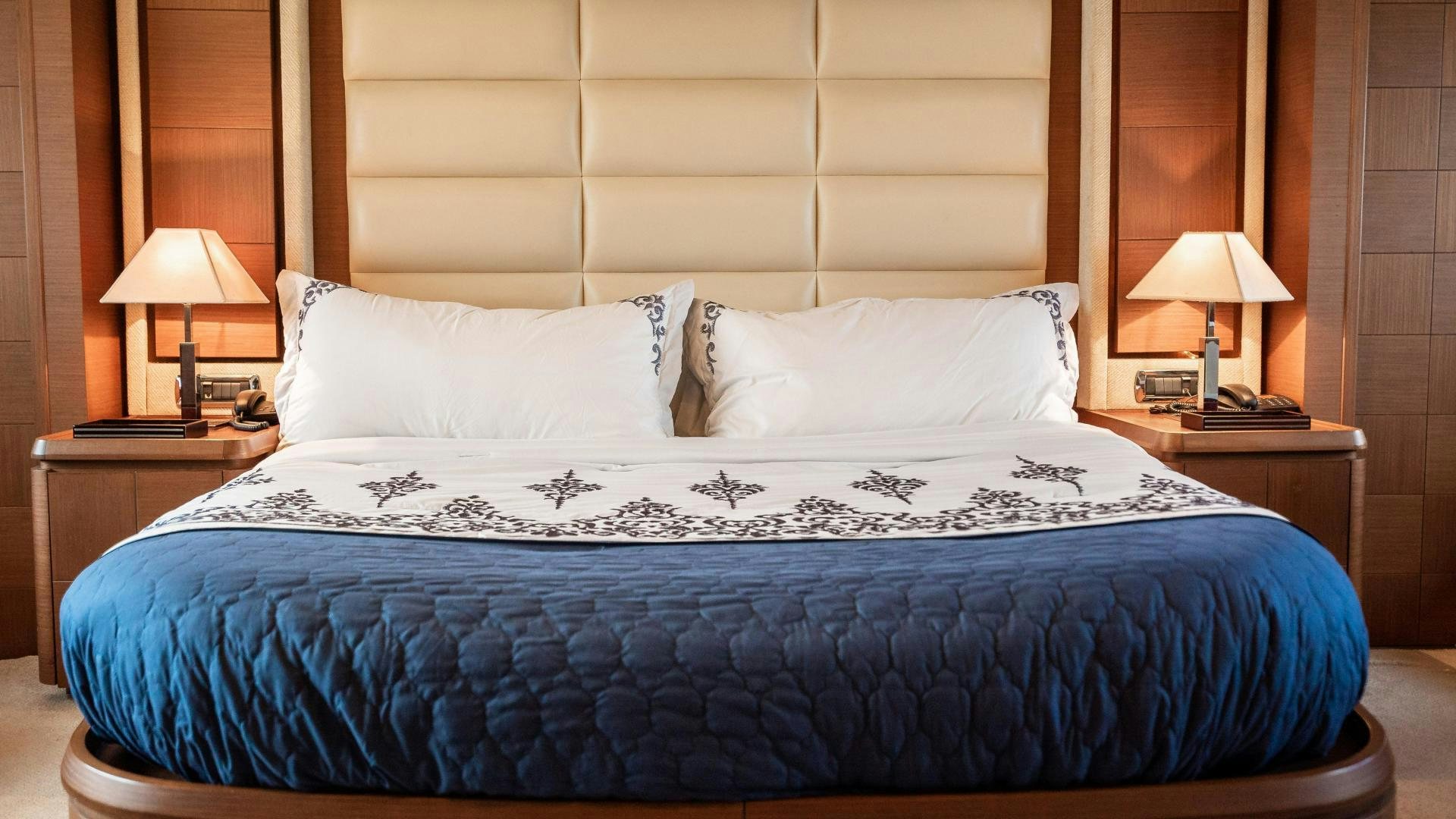 a bed with white sheets aboard CAMY ED Yacht for Sale