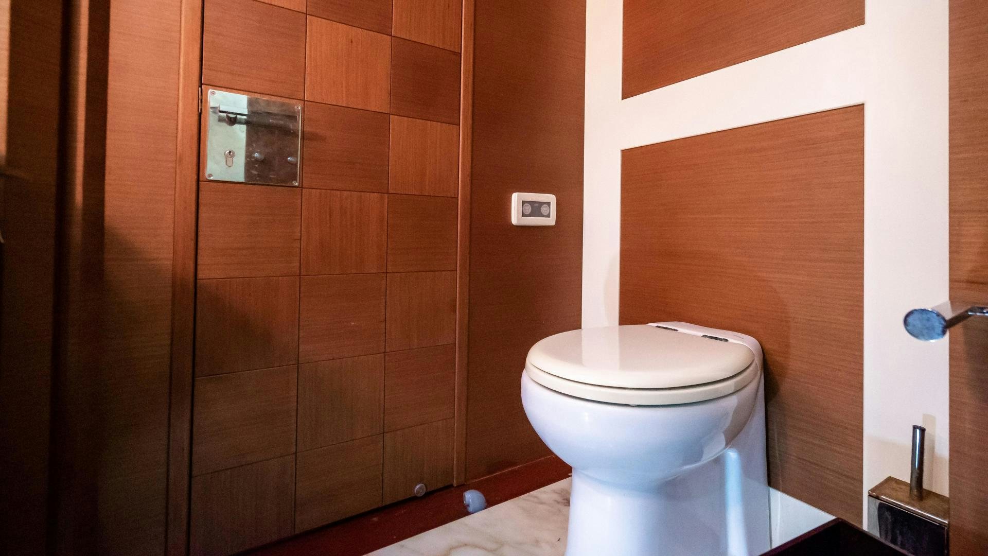 a toilet in a bathroom aboard CAMY ED Yacht for Sale