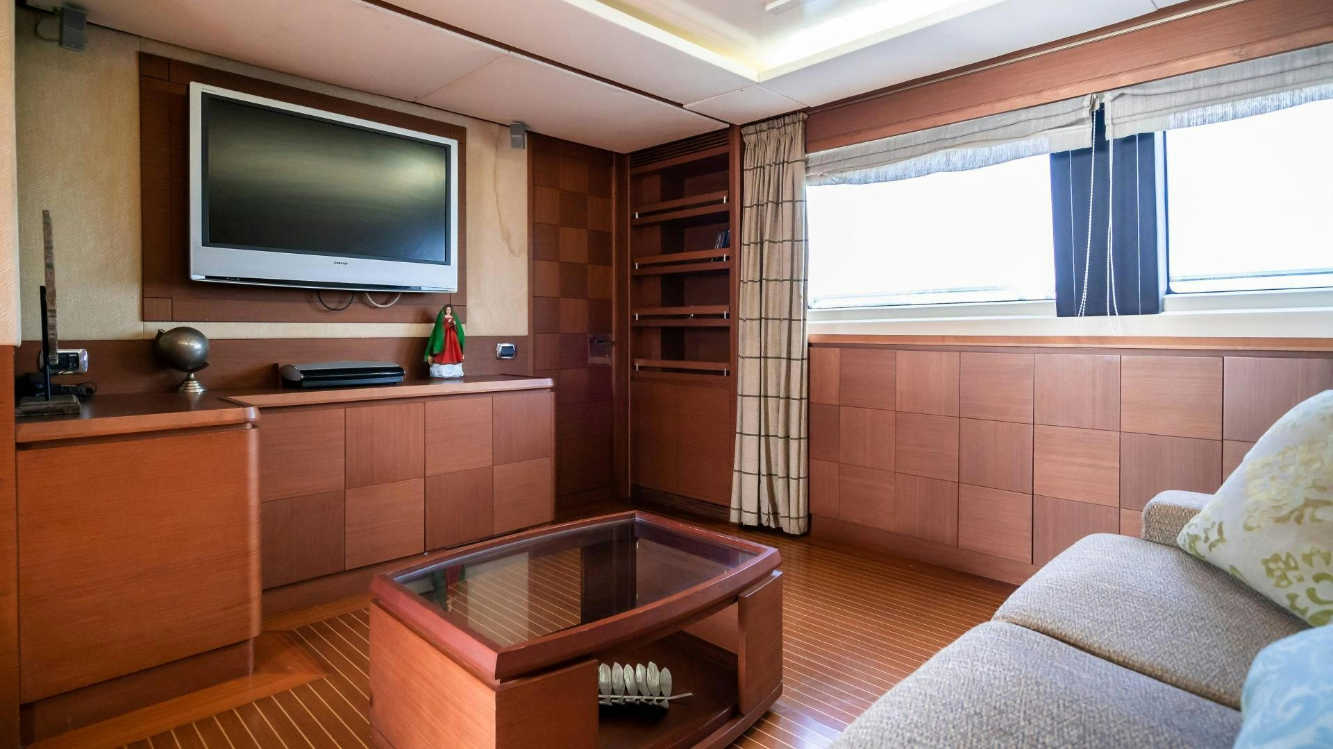 a living room with a tv and a couch aboard CAMY ED Yacht for Sale