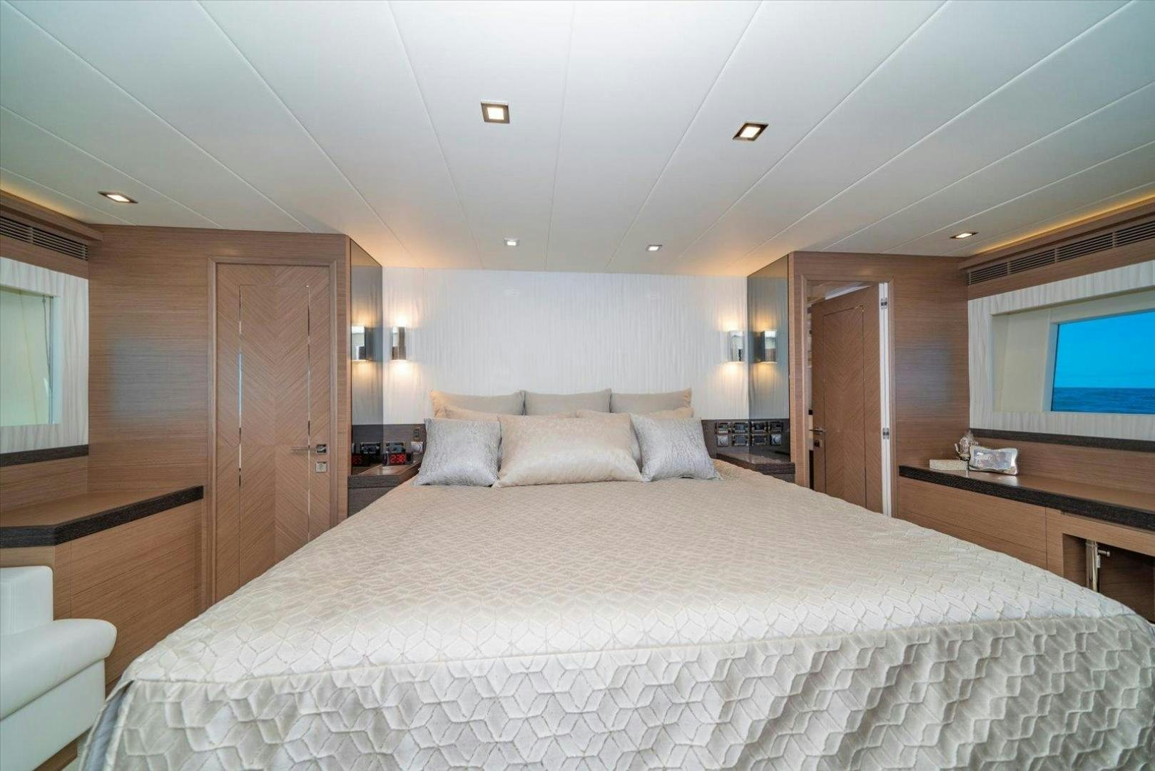 a large bed in a hotel room aboard VALIANT Yacht for Sale