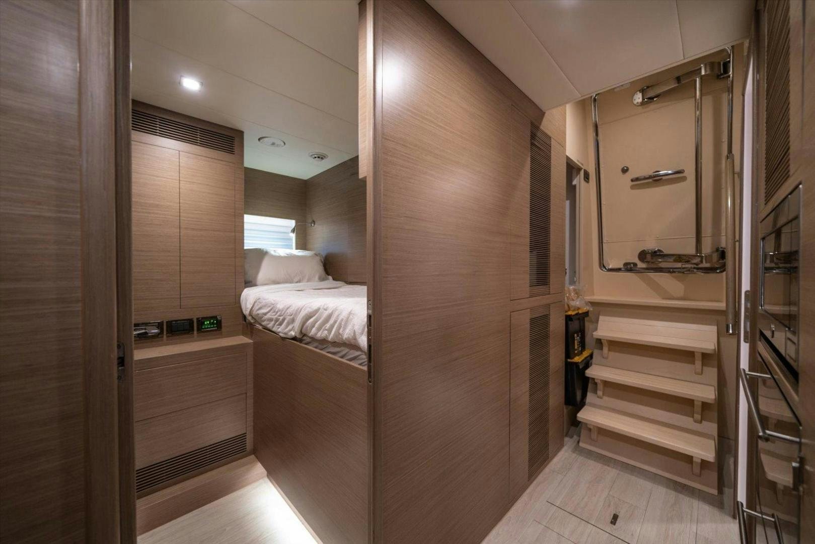 a room with a bed and a closet aboard VALIANT Yacht for Sale
