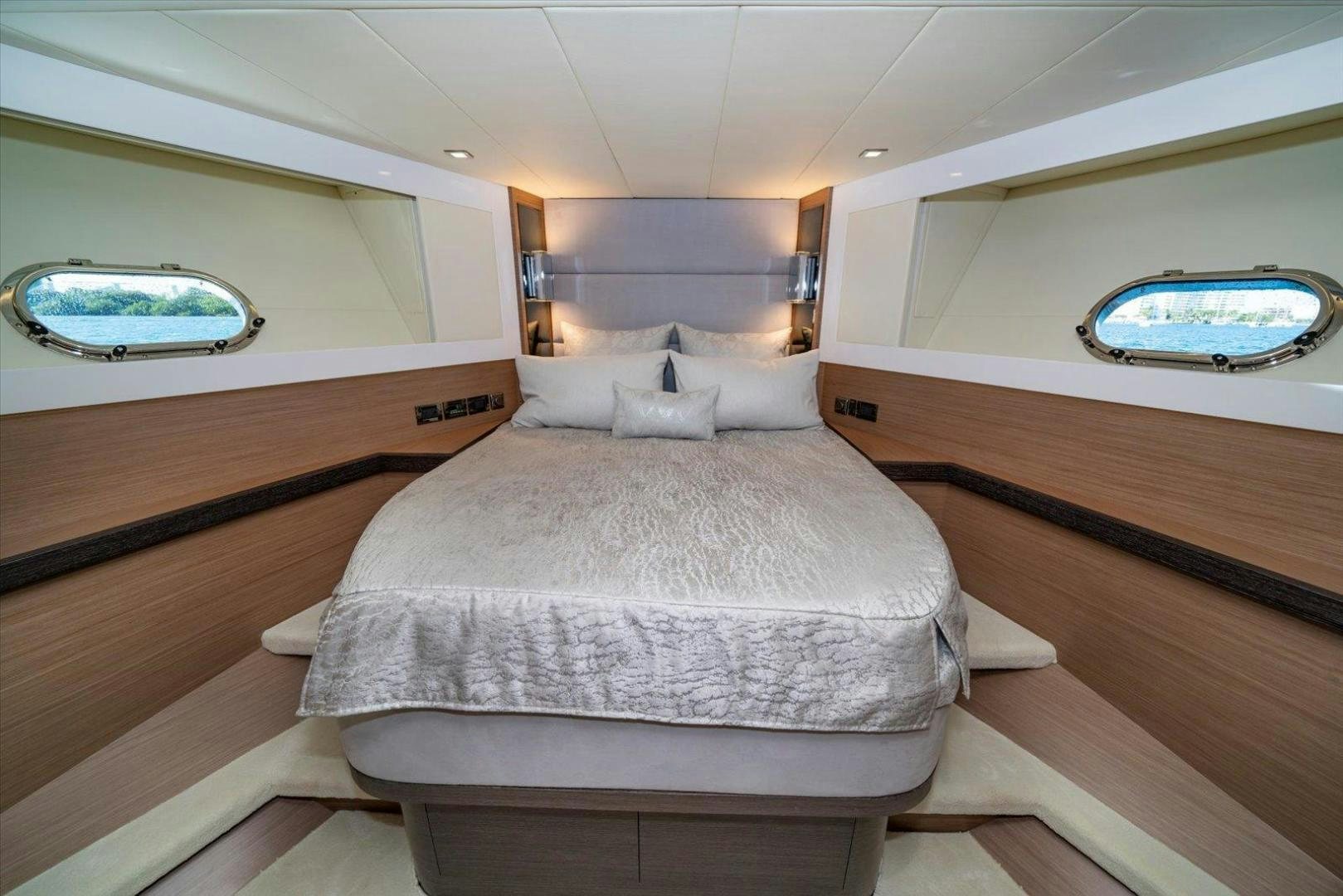 a room with a bed and a window aboard VALIANT Yacht for Sale