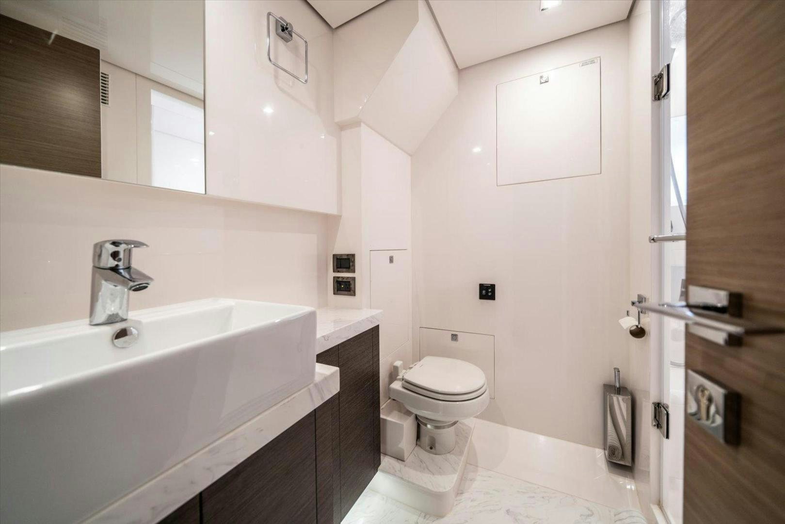 a bathroom with a sink toilet and a bathtub aboard VALIANT Yacht for Sale