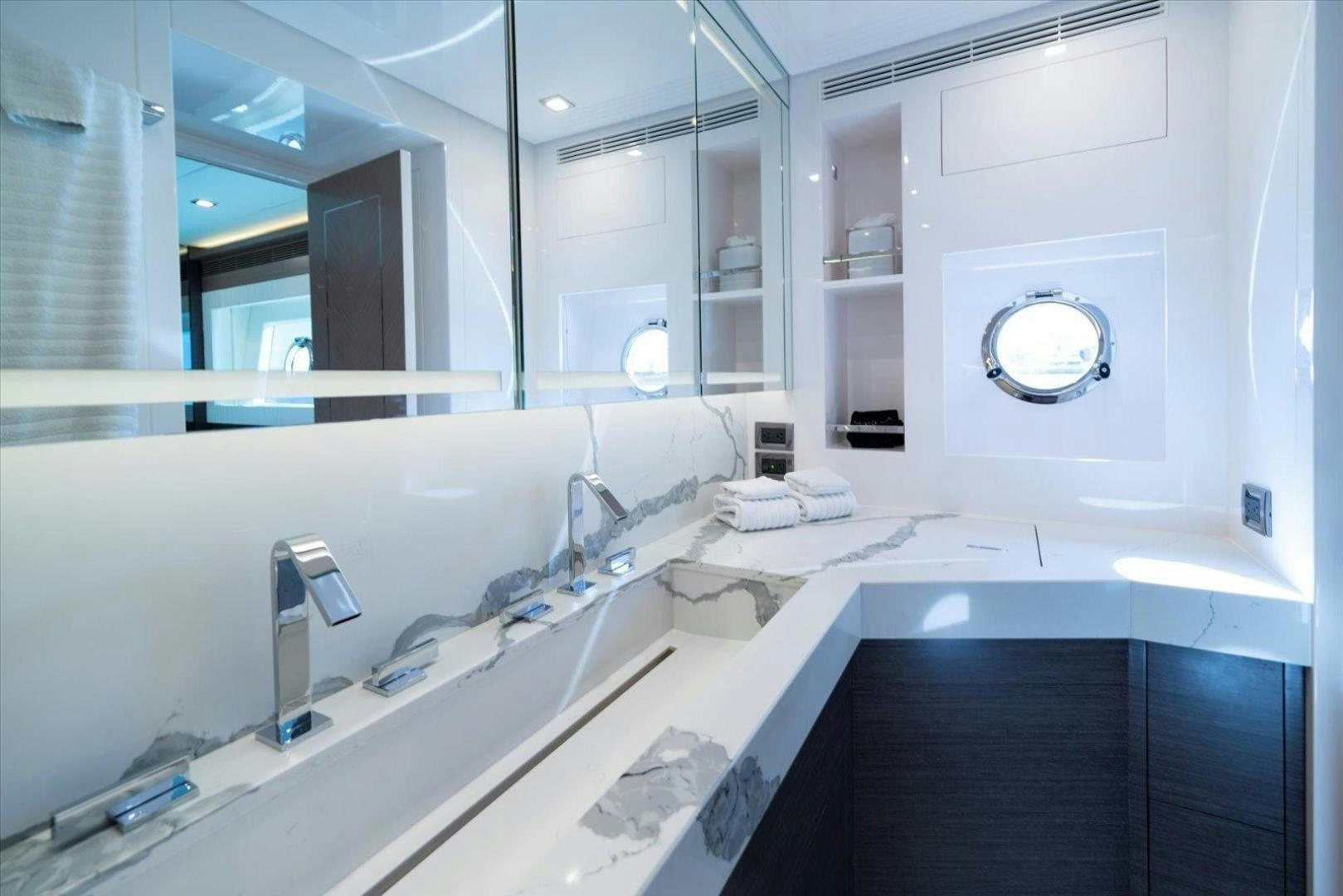 a bathroom with a large mirror aboard VALIANT Yacht for Sale