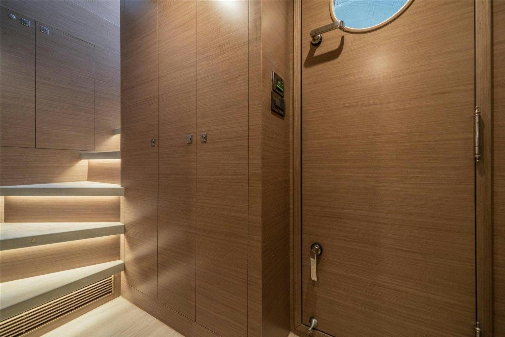 a room with wooden cabinets aboard VALIANT Yacht for Sale