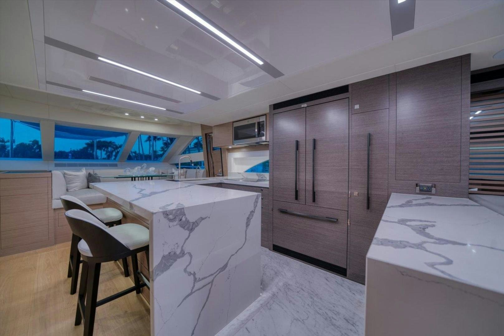 a kitchen with a table and chairs aboard VALIANT Yacht for Sale