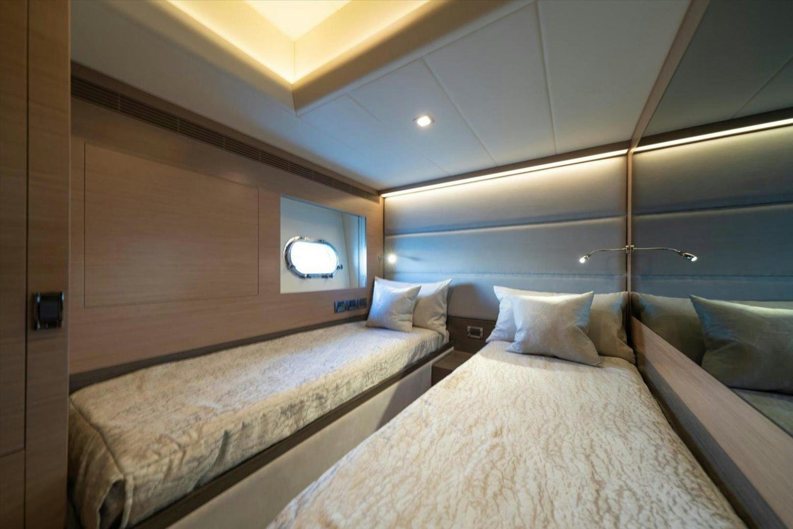a room with a bed and a window aboard VALIANT Yacht for Sale