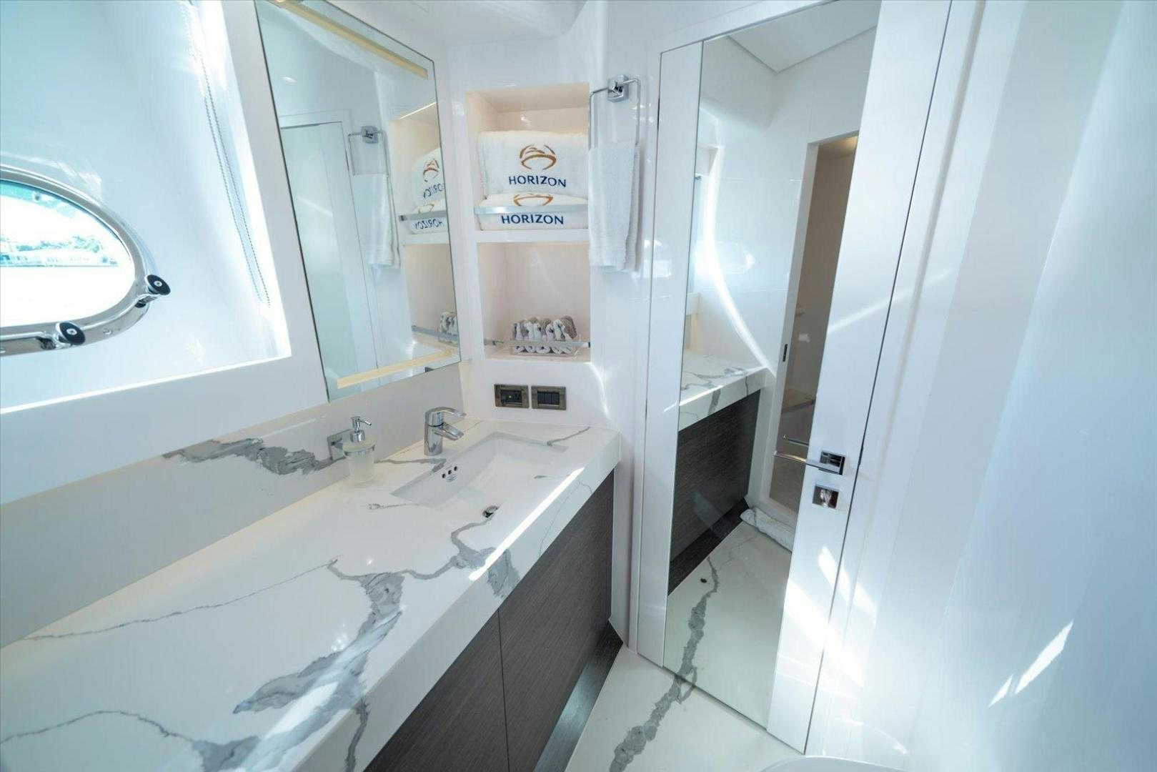 a bathroom with a sink and a mirror aboard VALIANT Yacht for Sale