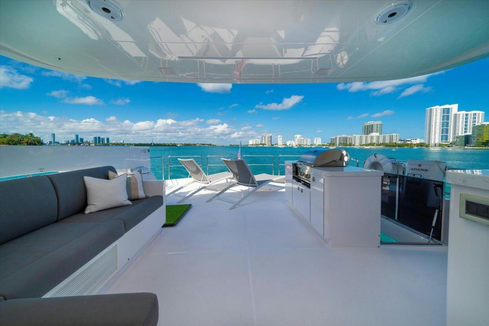 a room with a view of a city and a large body of water aboard VALIANT Yacht for Sale