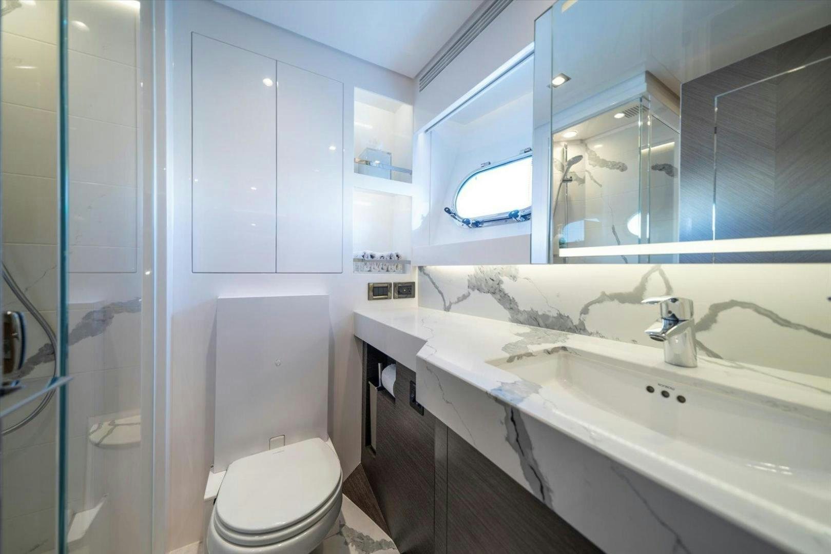 a bathroom with a sink toilet and a bathtub aboard VALIANT Yacht for Sale