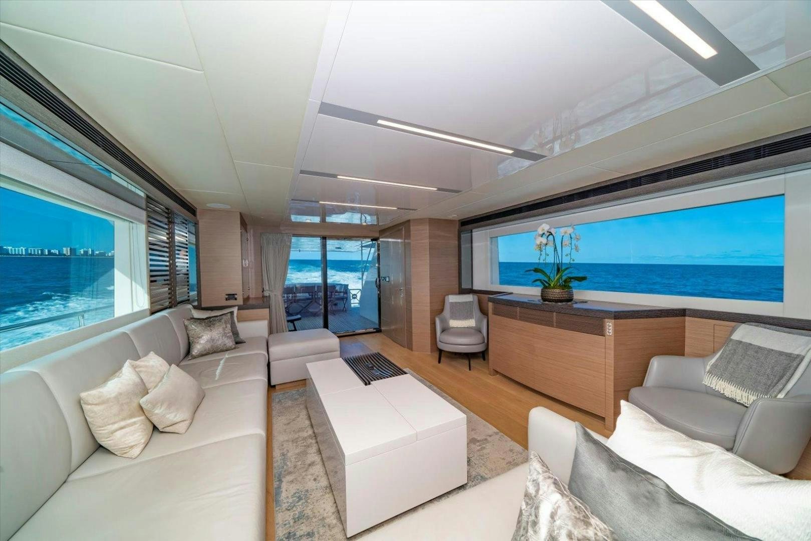 a room with a large window and a view of the ocean aboard VALIANT Yacht for Sale