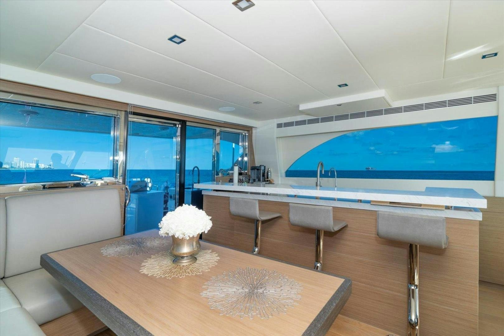 a large room with a table and chairs aboard VALIANT Yacht for Sale