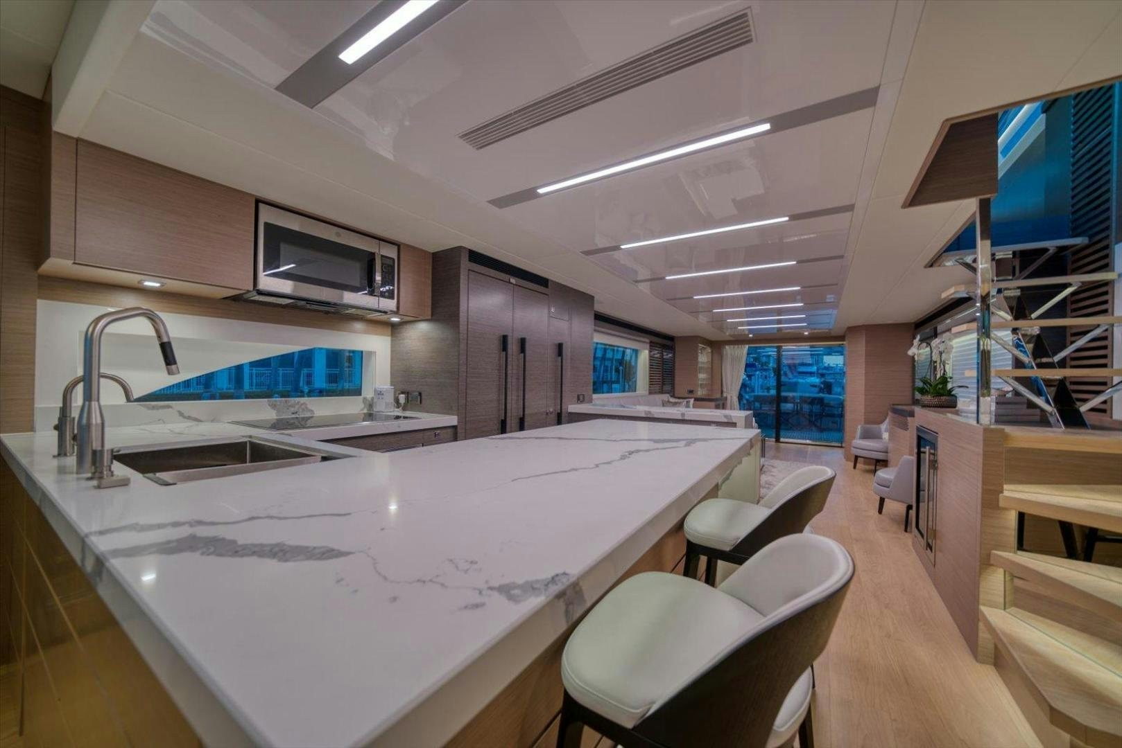 a large kitchen with a large island aboard VALIANT Yacht for Sale