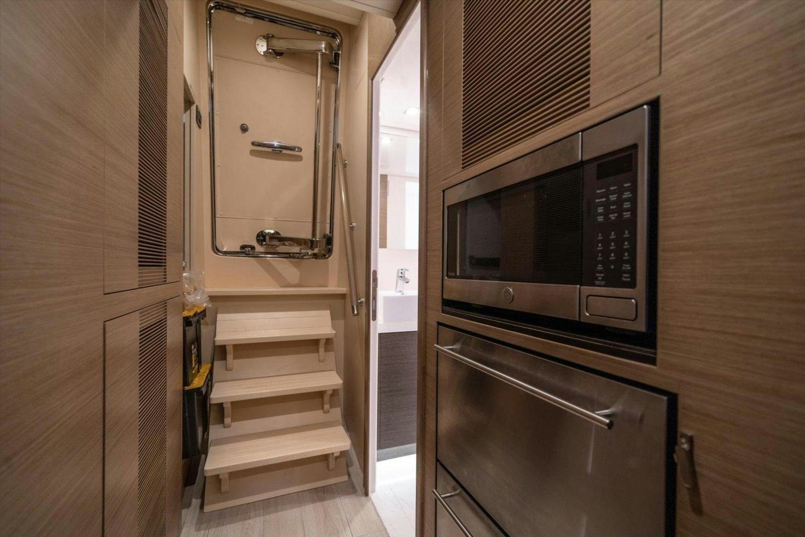 a kitchen with a microwave oven aboard VALIANT Yacht for Sale