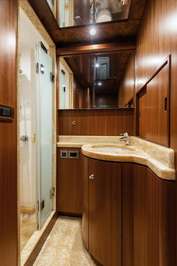 a bathroom with a sink and cabinets aboard Goodlife Yacht for Sale