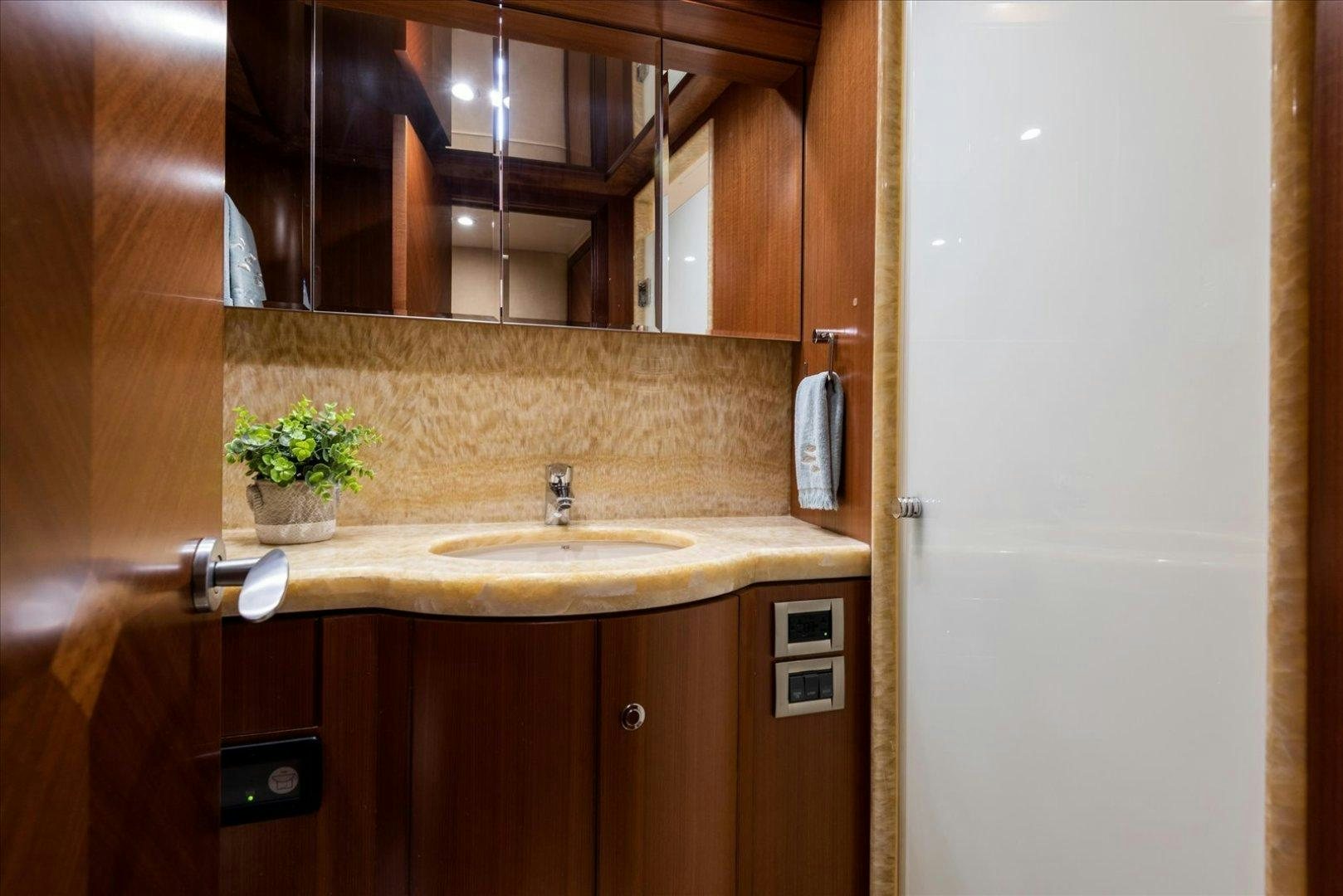 a bathroom with a sink and a mirror aboard Goodlife Yacht for Sale