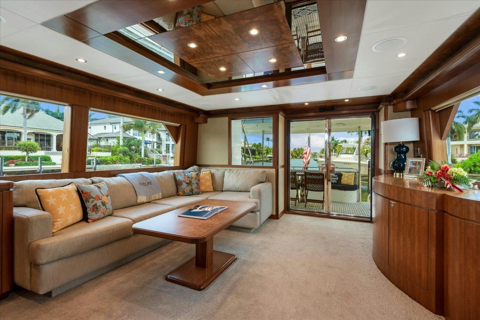 a living room with a large open door aboard Goodlife Yacht for Sale