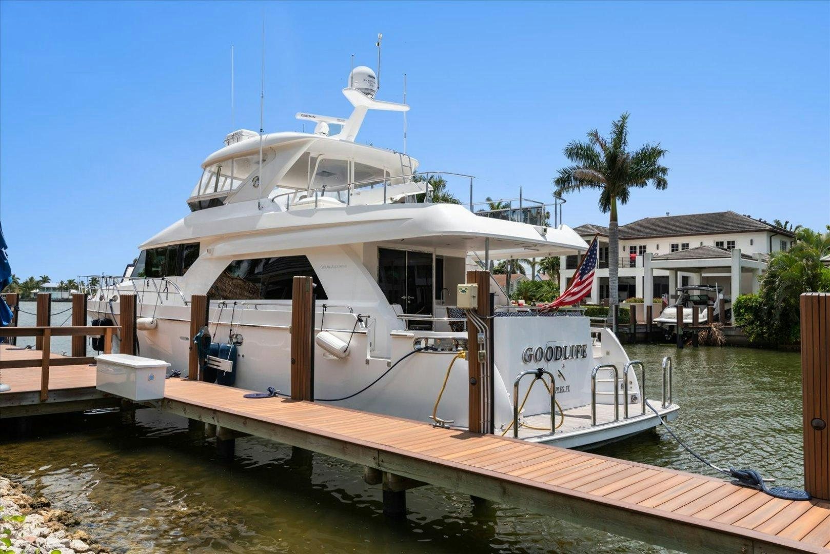 a boat docked at a pier aboard Goodlife Yacht for Sale