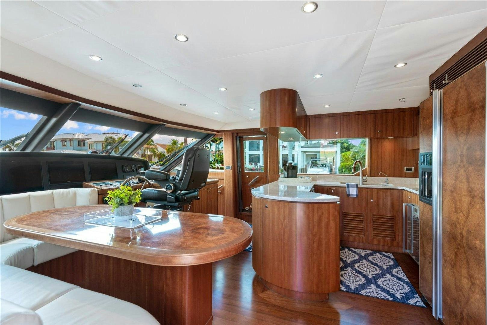 a kitchen with a table and chairs aboard Goodlife Yacht for Sale