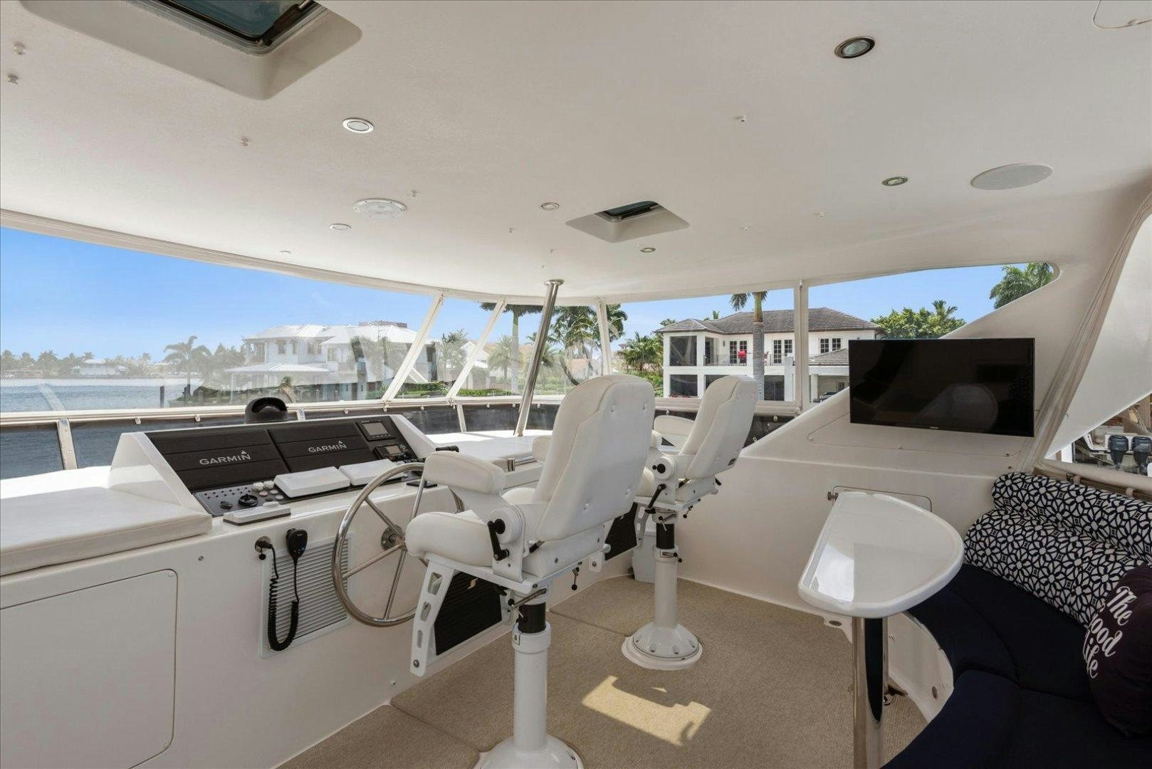 a room with a view of the water and a city aboard Goodlife Yacht for Sale
