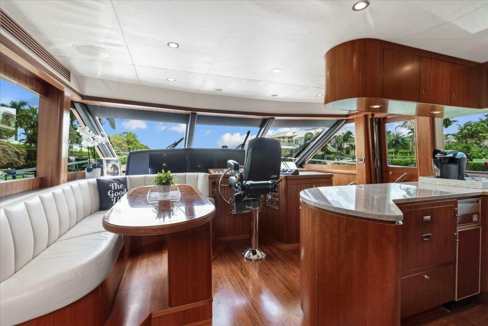 a room with a table and chairs aboard Goodlife Yacht for Sale