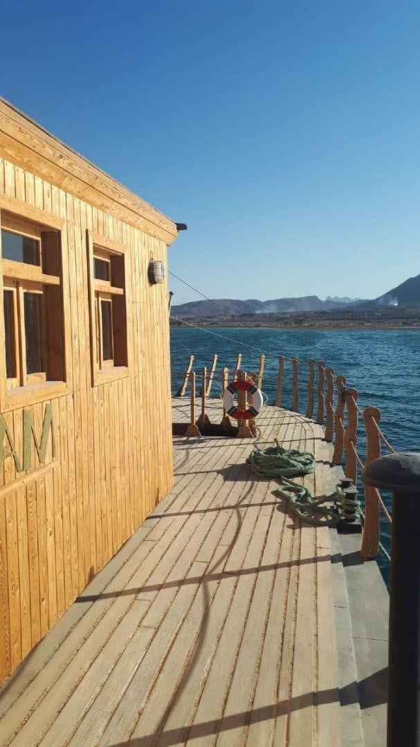 a wooden dock on a boat aboard USS WILLIAMSBURG Yacht for Sale