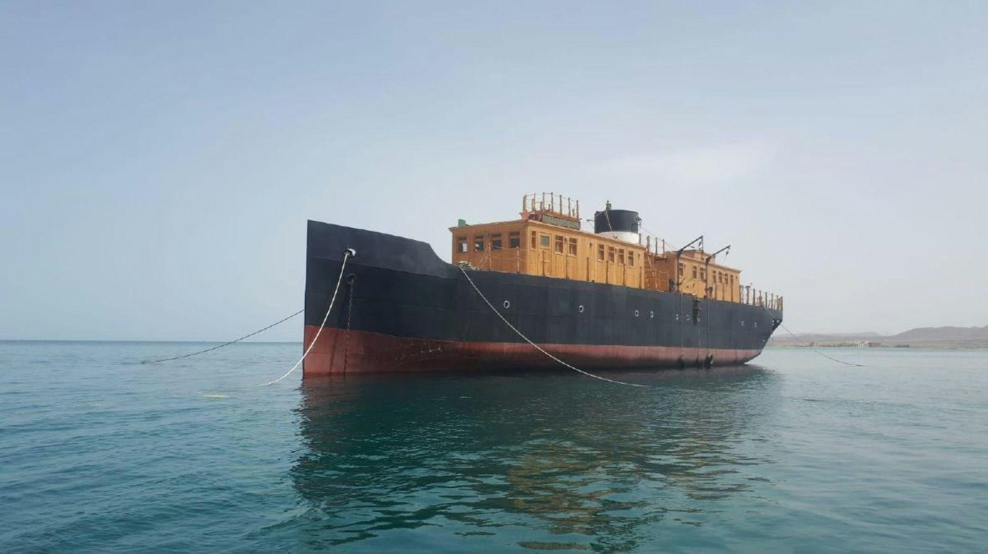 a large boat in the water aboard USS WILLIAMSBURG Yacht for Sale