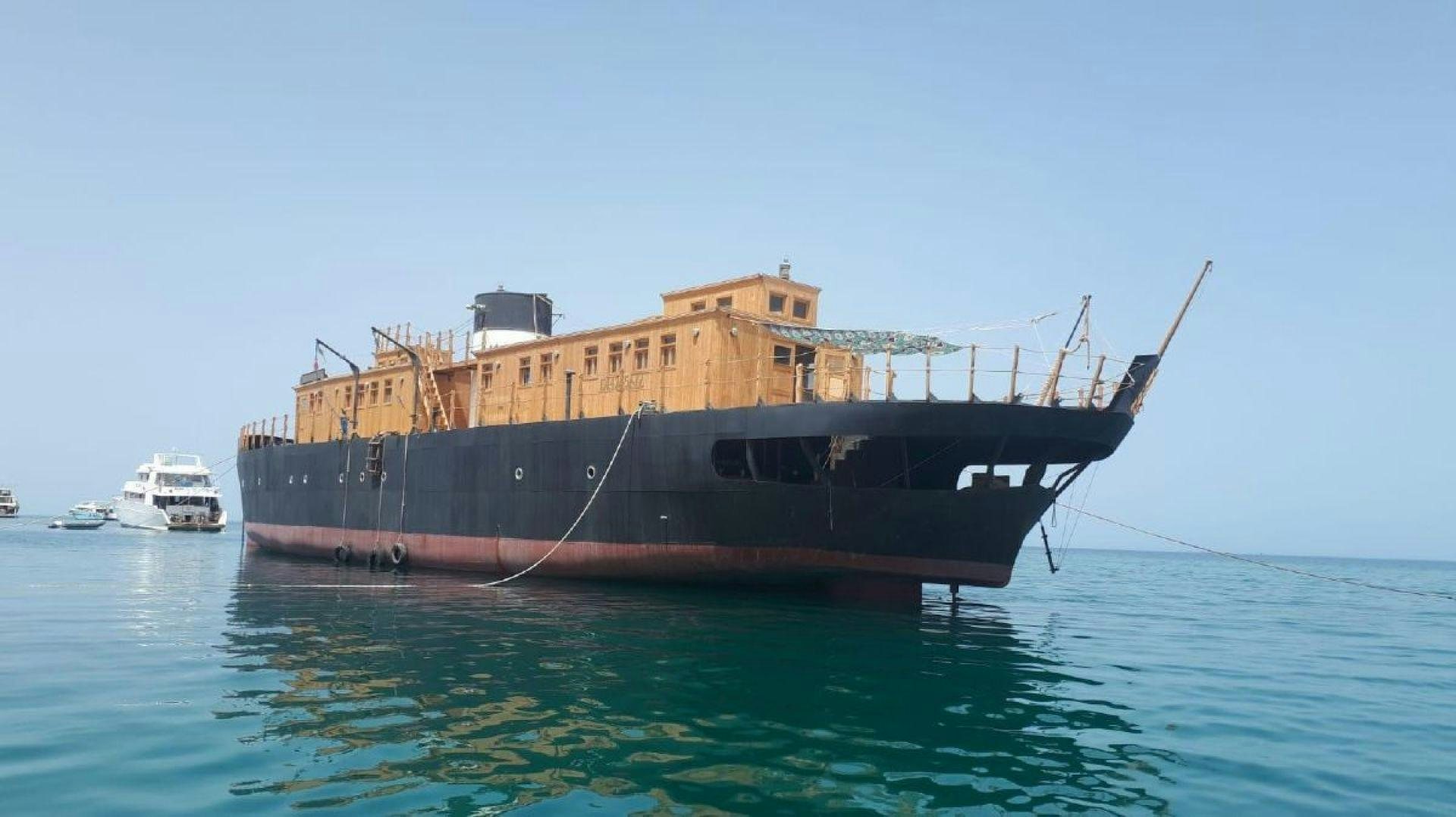 a boat in the water aboard USS WILLIAMSBURG Yacht for Sale