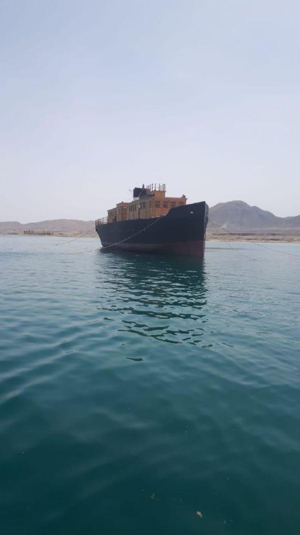 a boat in the water aboard USS WILLIAMSBURG Yacht for Sale