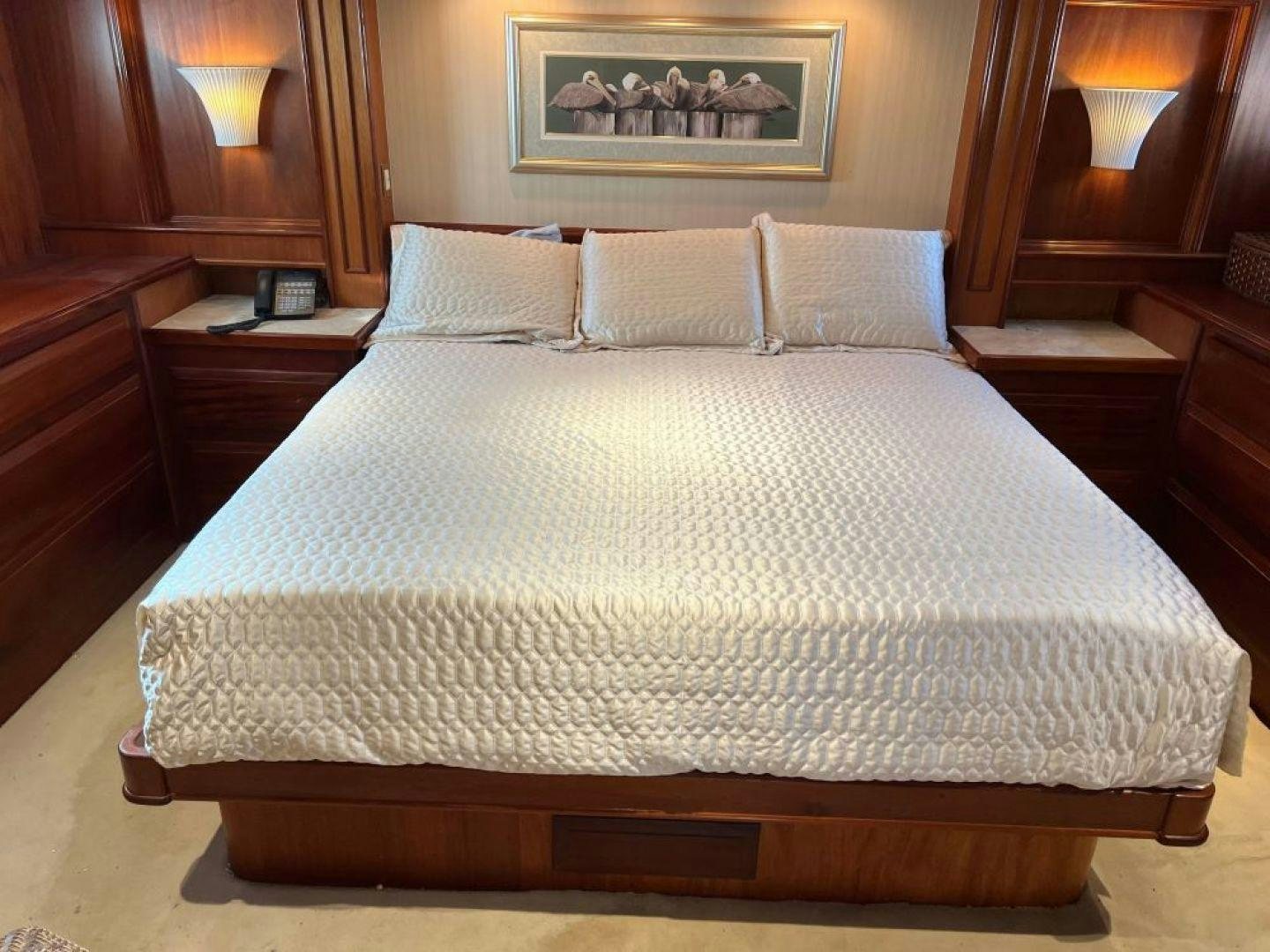 a bed with white sheets aboard AQUILA JOVIS Yacht for Sale