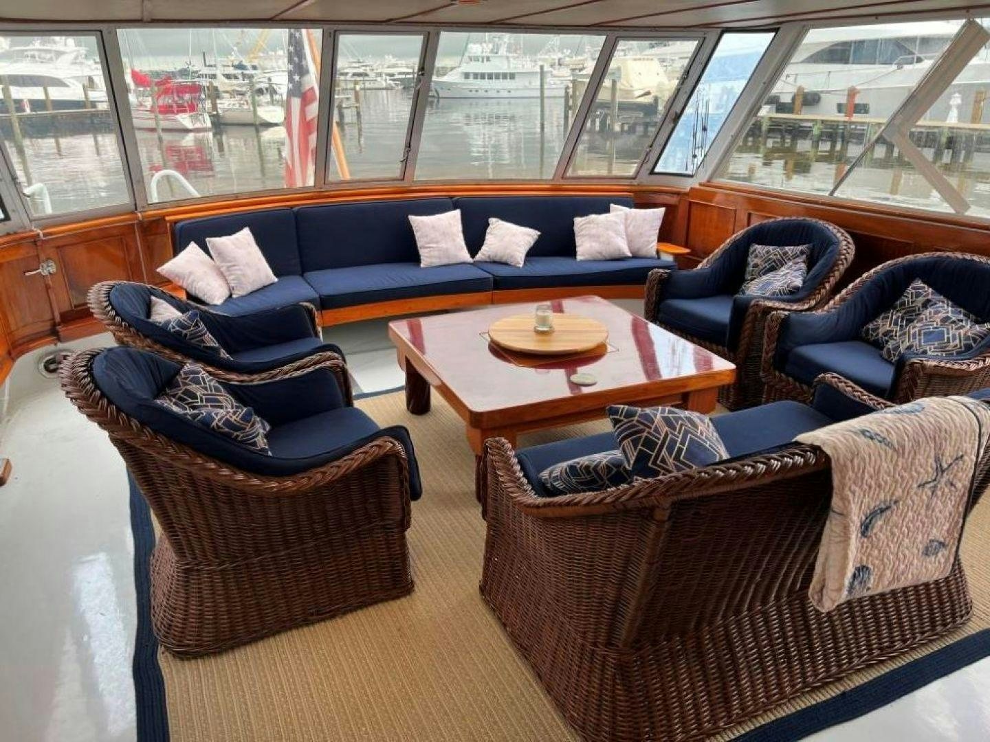a living room with a couch and a coffee table aboard AQUILA JOVIS Yacht for Sale