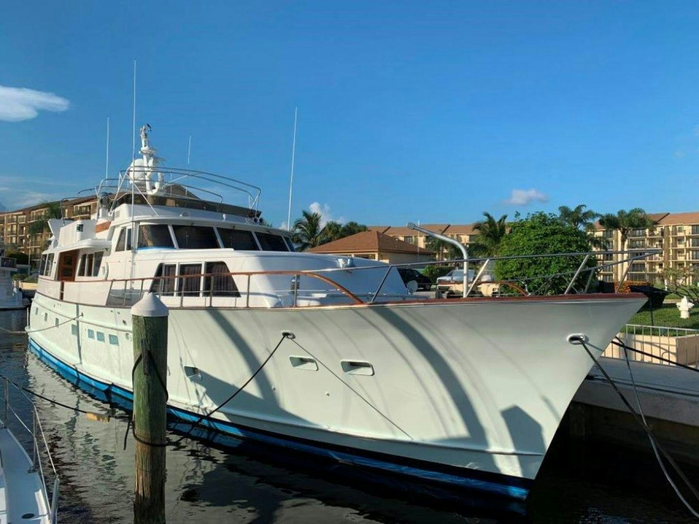 a boat docked at a pier aboard AQUILA JOVIS Yacht for Sale