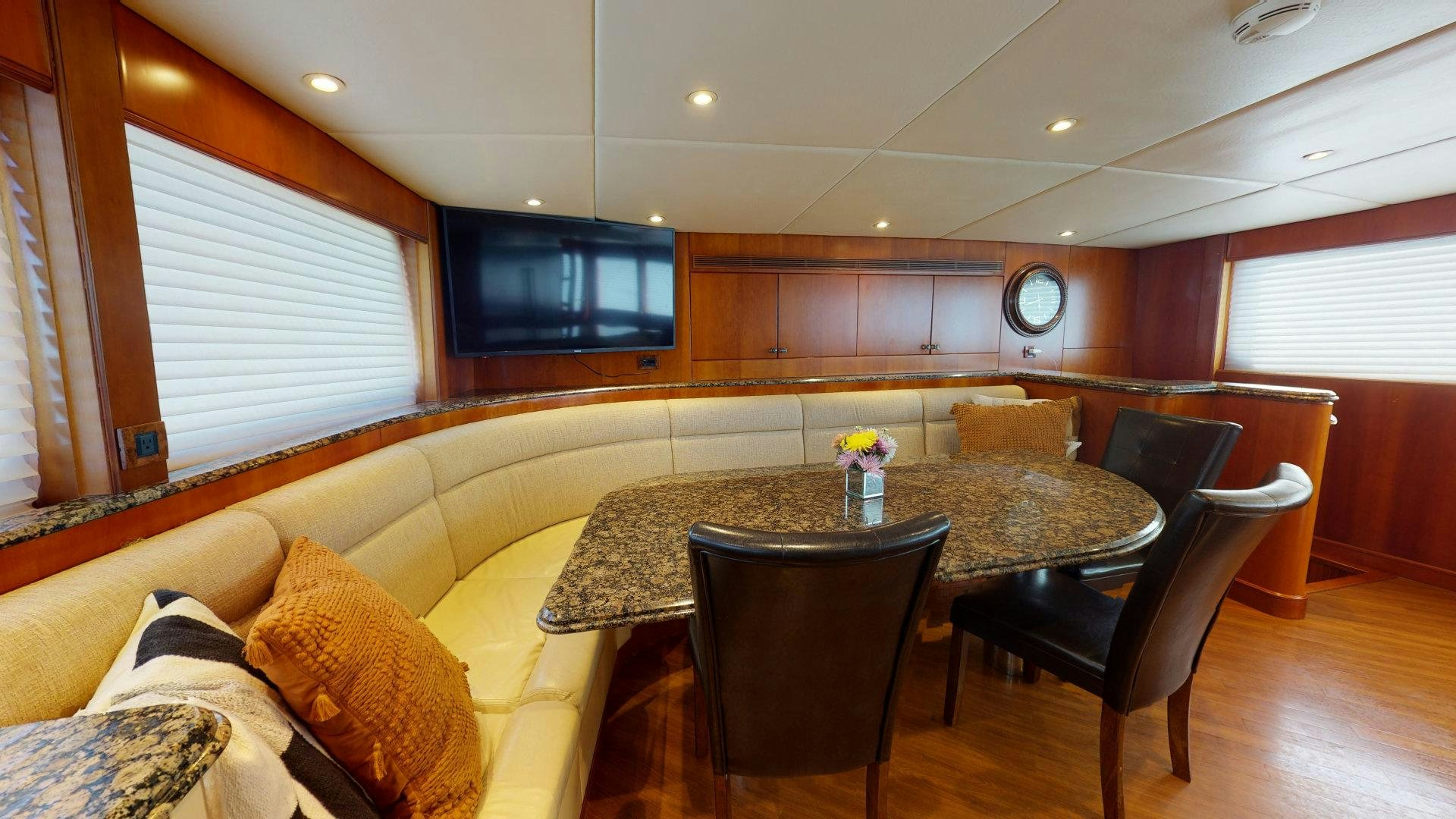 a living room with a couch and a table aboard SUMMER LOVE Yacht for Sale