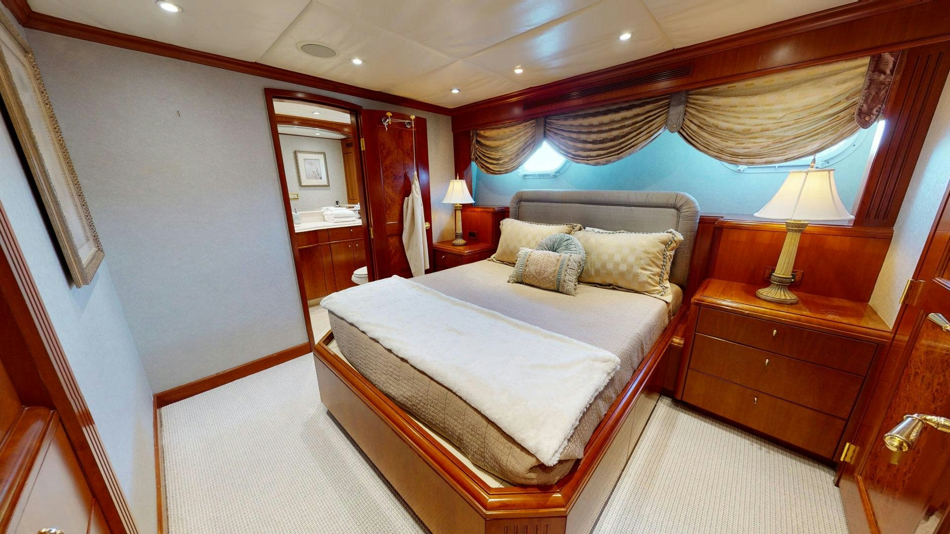 a room with a bed and a lamp aboard SUMMER LOVE Yacht for Sale
