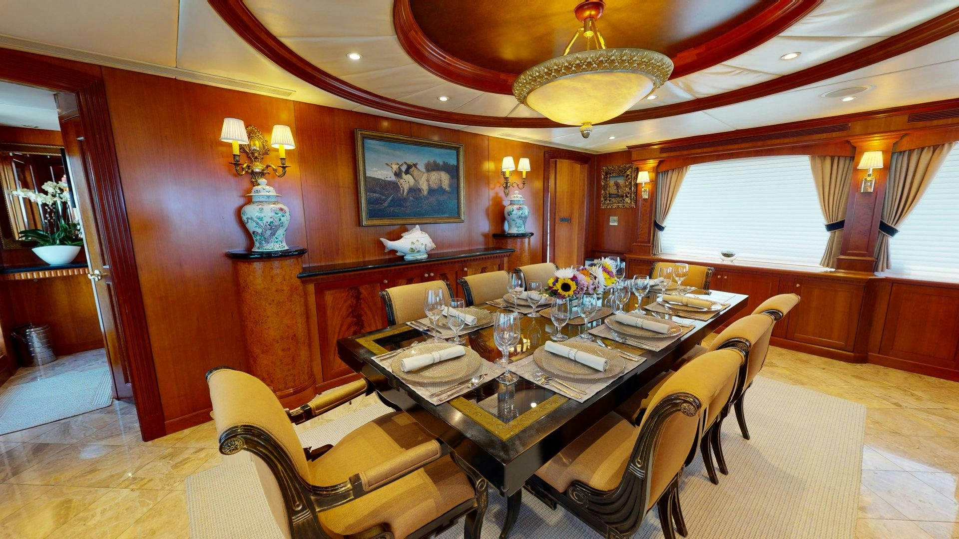 a dining room with a table and chairs aboard SUMMER LOVE Yacht for Sale
