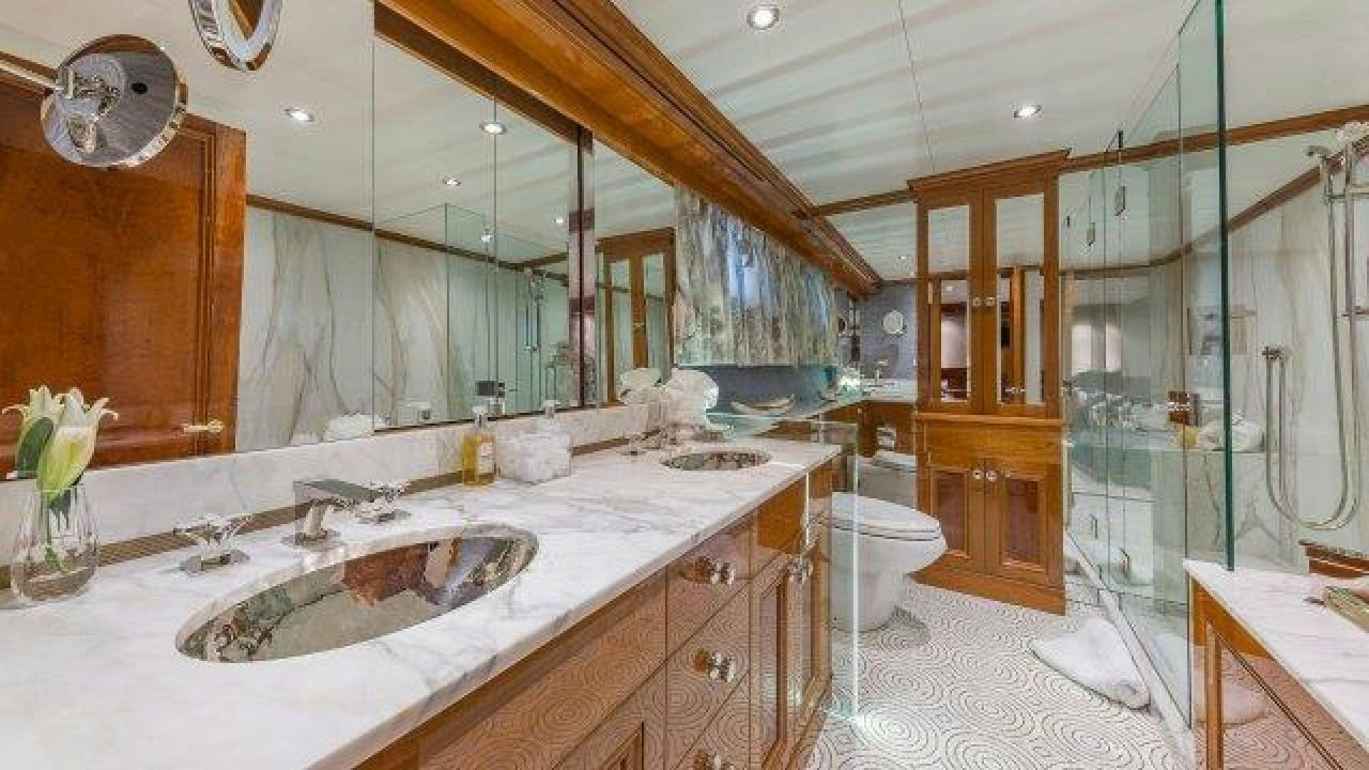 a bathroom with a large mirror aboard ARIADNE Yacht for Sale