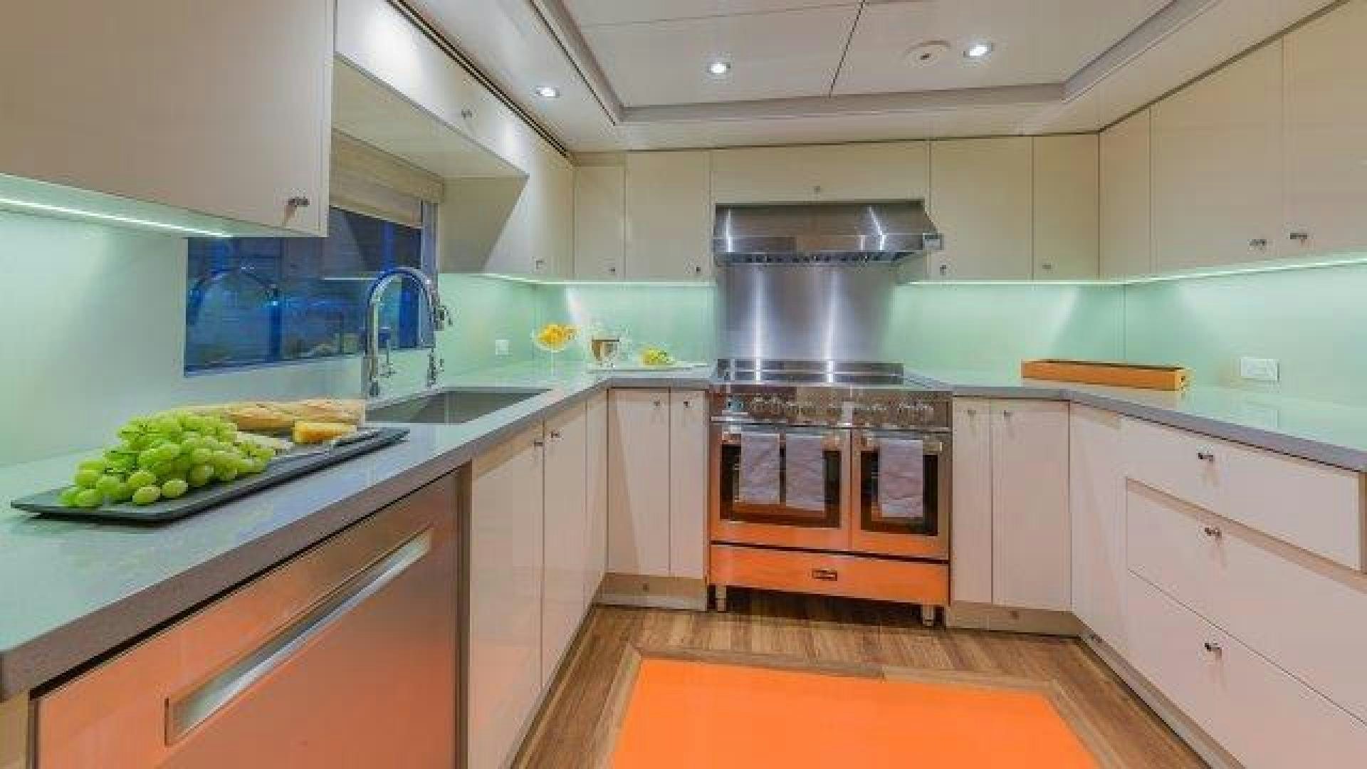 a kitchen with white cabinets aboard ARIADNE Yacht for Sale