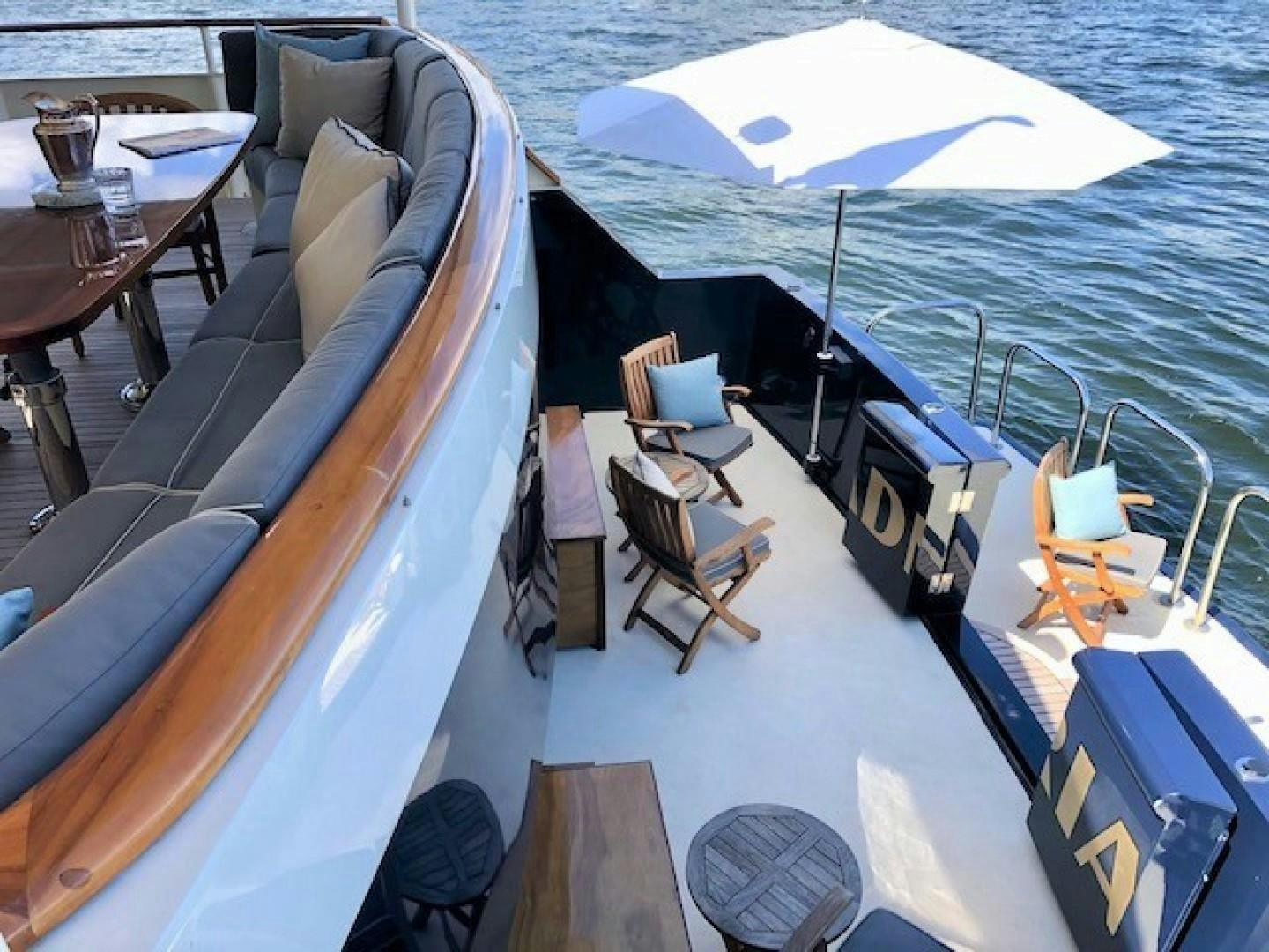 a boat with a table and chairs aboard ARIADNE Yacht for Sale