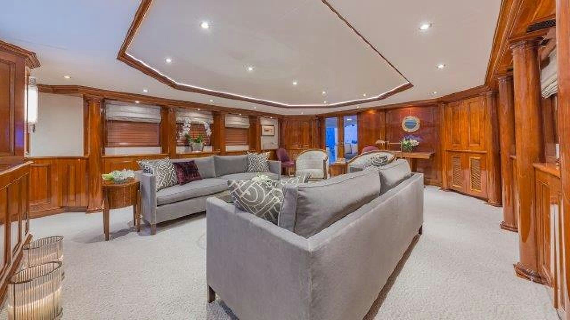 a living room with a couch and a table aboard ARIADNE Yacht for Sale