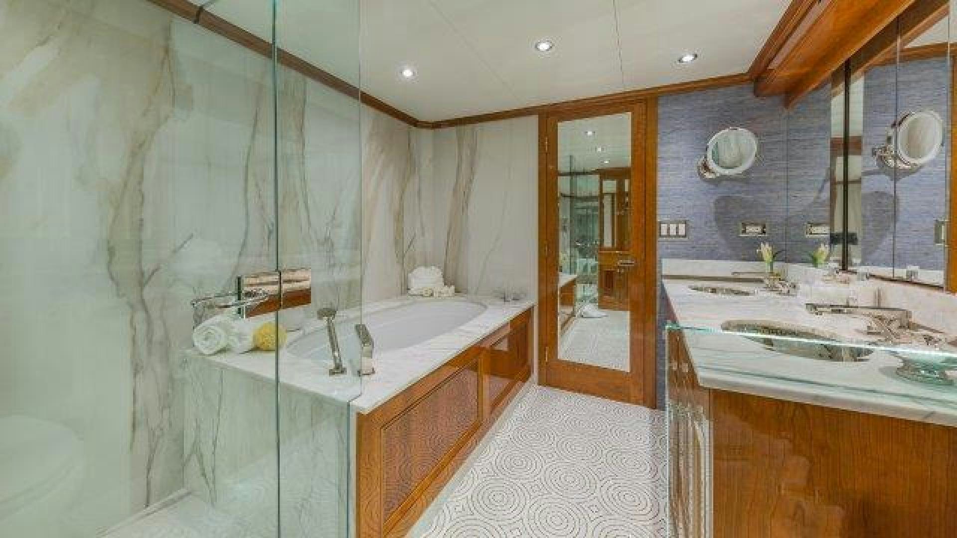 a bathroom with a tub sink and a shower aboard ARIADNE Yacht for Sale