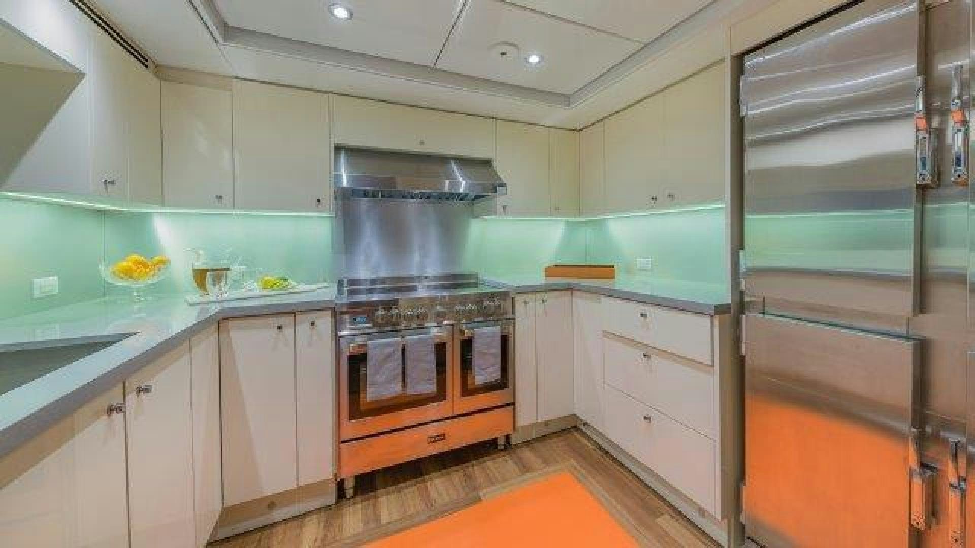 a kitchen with a stainless steel stove aboard ARIADNE Yacht for Sale