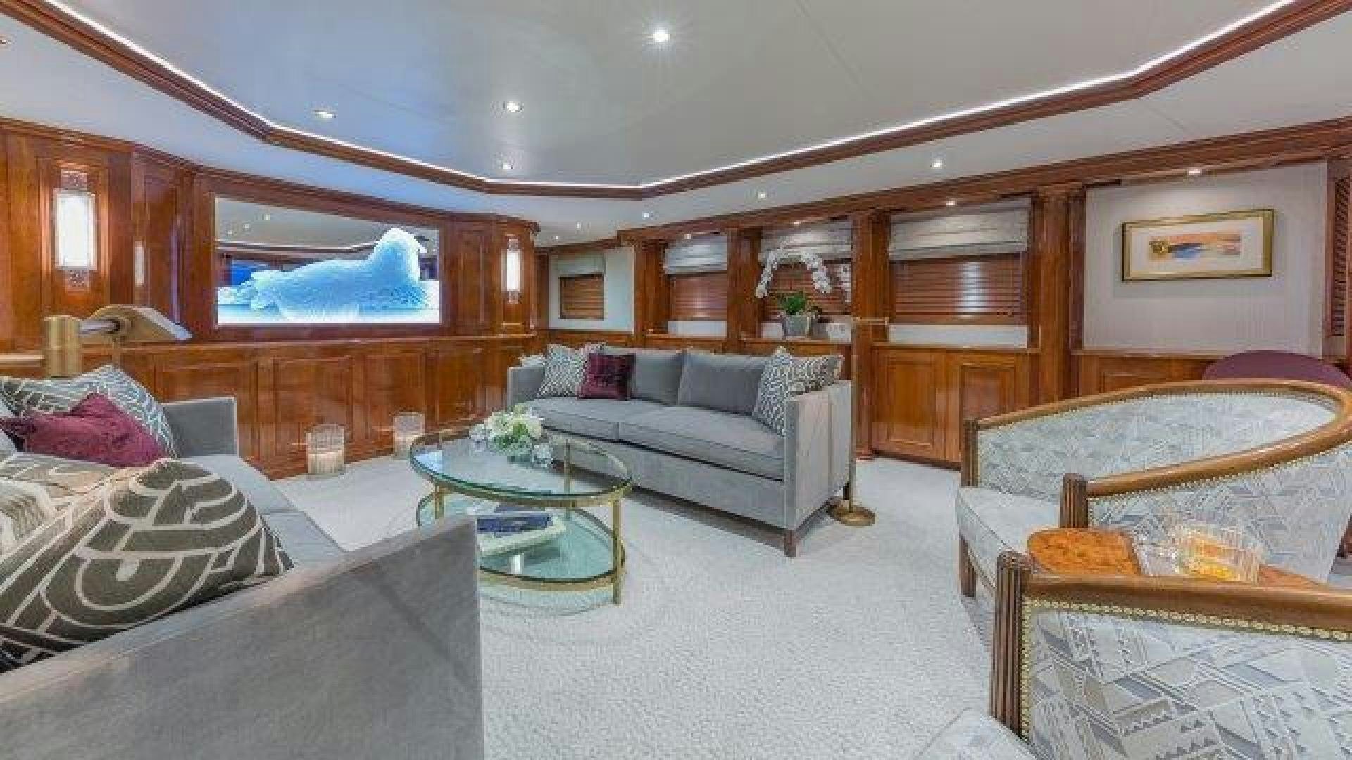 a living room with a couch and a table aboard ARIADNE Yacht for Sale