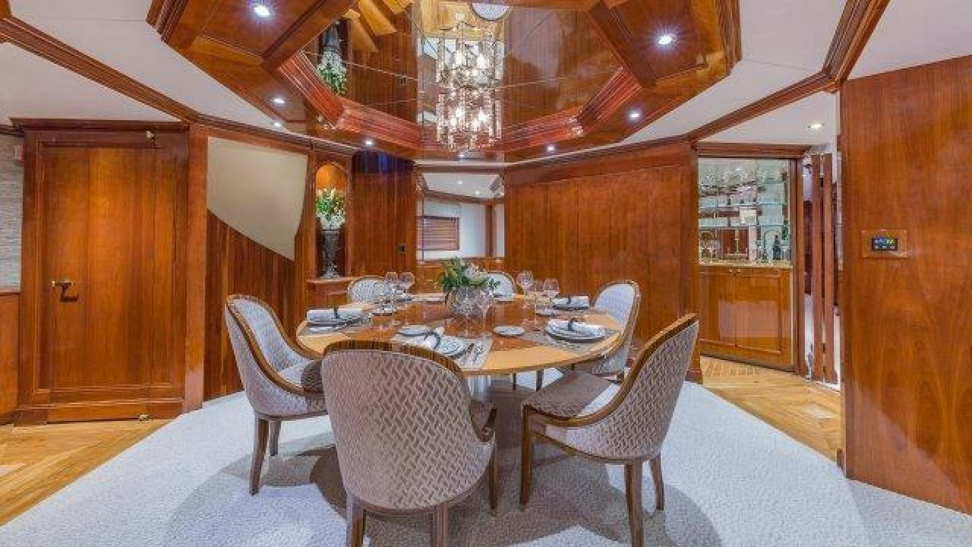 a dining table and chairs aboard ARIADNE Yacht for Sale