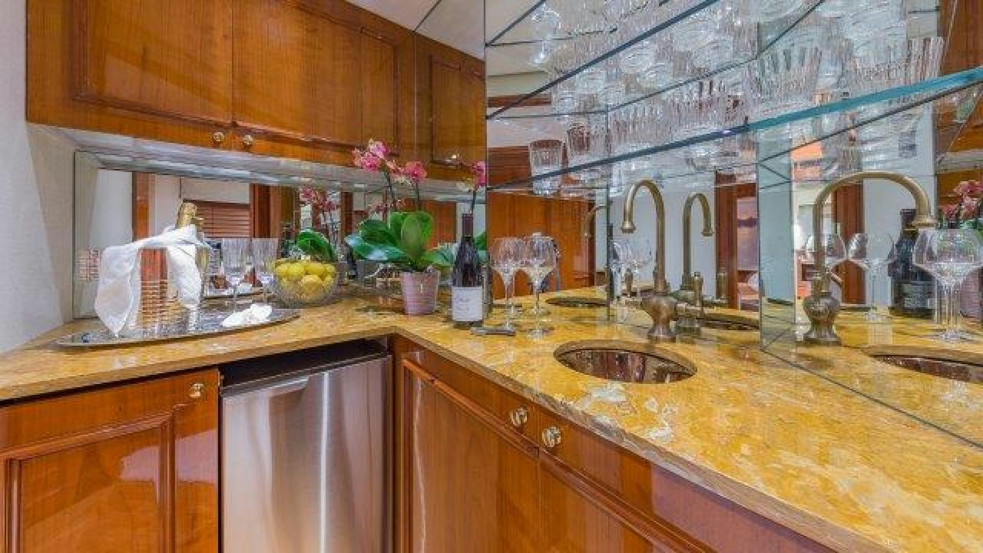 a kitchen with a sink and cabinets aboard ARIADNE Yacht for Sale
