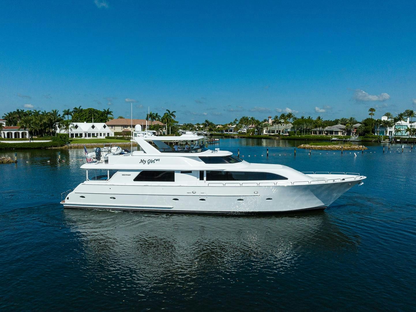 a white boat in a body of water aboard MY GIRL Yacht for Sale