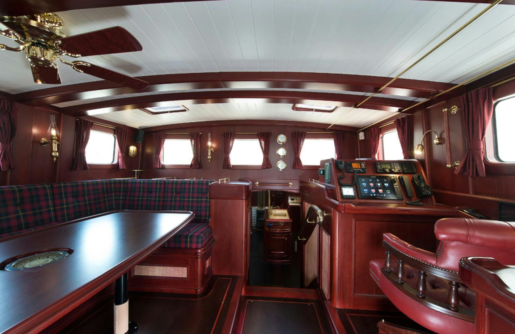 a room with a bar and a table aboard SPIRIT OF VENICE Yacht for Sale