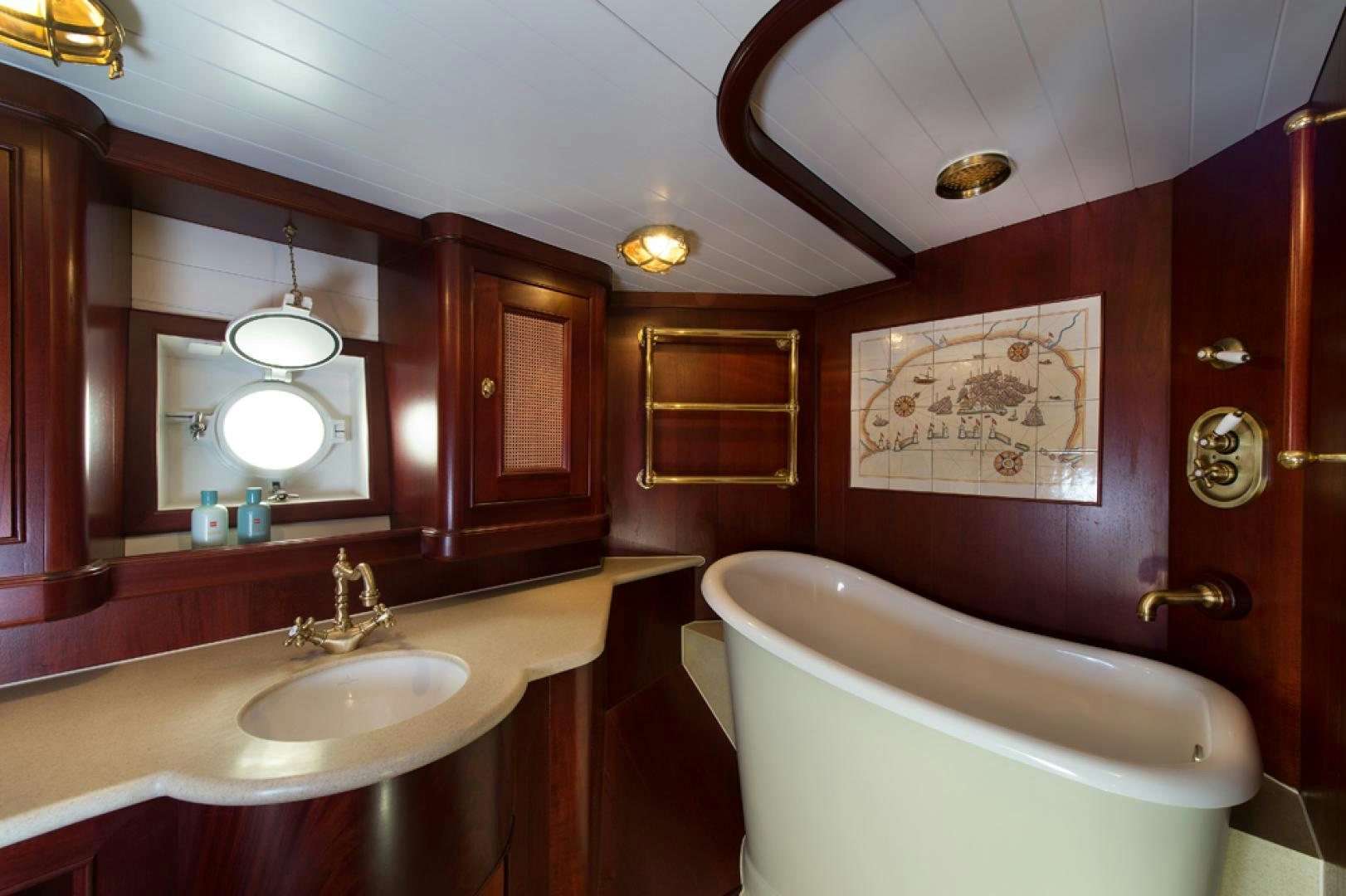 a bathroom with a tub sink and a sink aboard SPIRIT OF VENICE Yacht for Sale