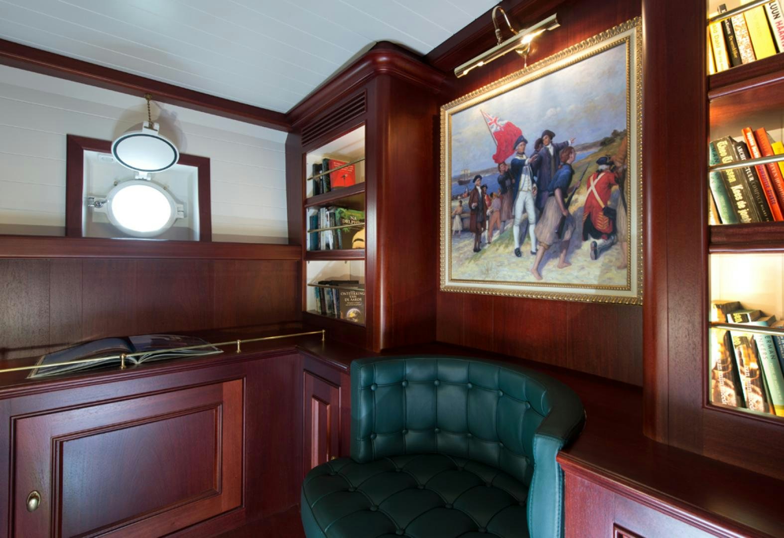 a room with a chair and a desk and a mirror aboard SPIRIT OF VENICE Yacht for Sale